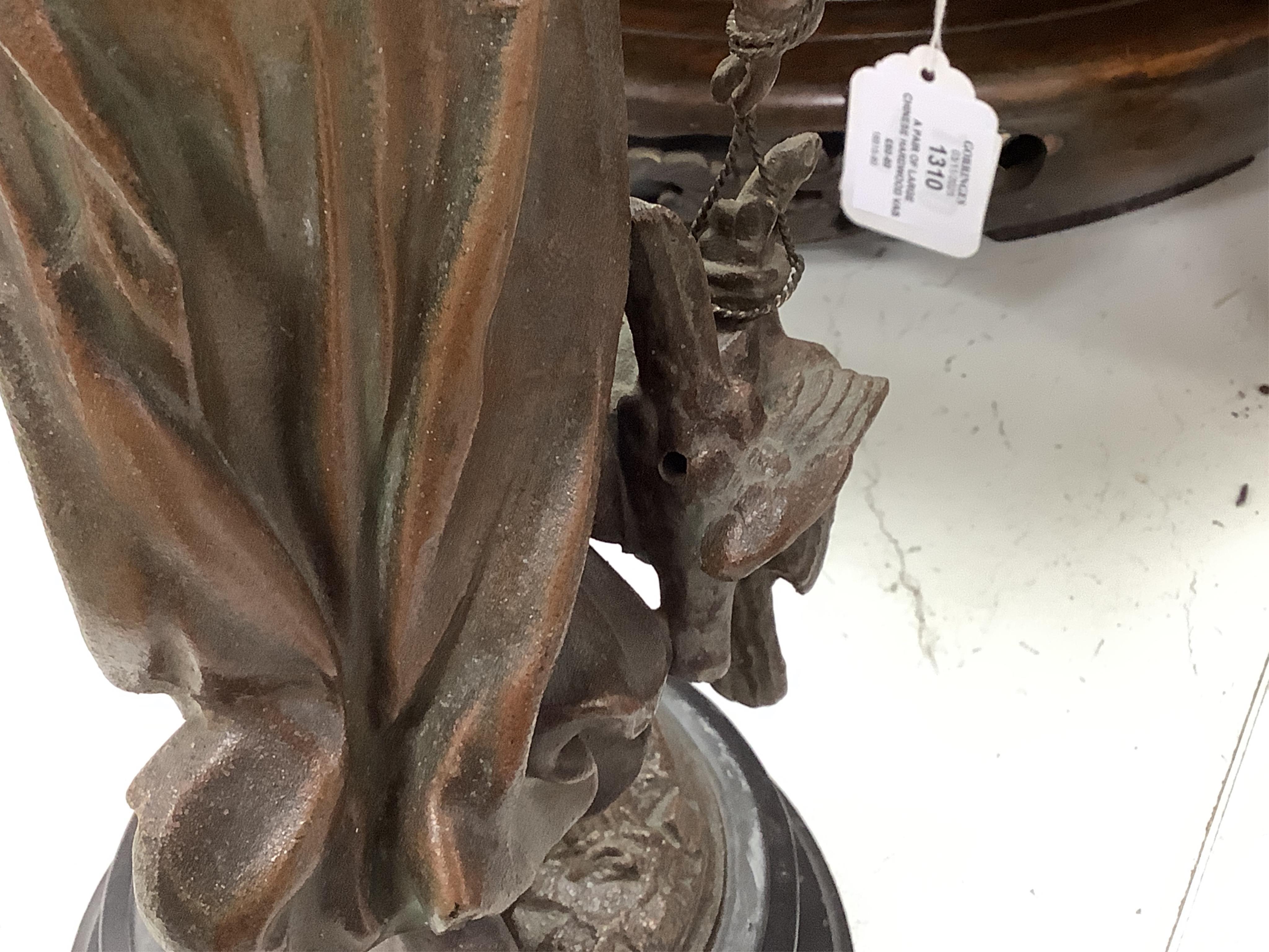A late 19th century spelter figural mystery clock, 63cm high